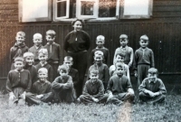 Jan Klimeš (completely on the left in the upper row with a pioneer scarf) at a pioneer camp in the 1950s 
