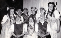 
Aloisie Foltýnková (second from right in top row) with members of an amateur theater group (wearing original Hlučín folk costumes) Markvartovice / around 1955