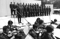 Vít Nejedlý Army Art Ensemble, Jan Noha is the first from the left in the back row (standing on a stool), Zdeněk Šmukař is at the microphone, 1976 or 1977

