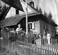 Vlasta Ručková with her husband (in the front, raising the flag) on a trip, the 1950s