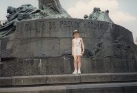 Her daughter Dobroslava next to a memorial in Prague (1994)