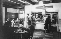In a diner, 1950s