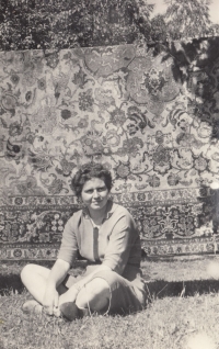 Ivana Bouchnerová in the garden with a Persian rug
