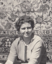 Ivana Bouchnerová in the garden with a Persian rug