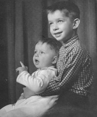 Jan Dytrych holding his younger brother Pavel in his arms, 1960