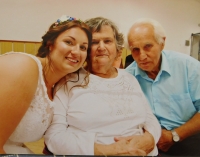 Mr. and Mrs. Pospíšil with their granddaughter