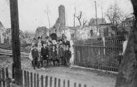 Inhabitants of Štítina in front of the ruins of their village buildings in 1945