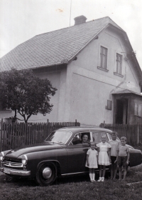 Ludmila Jahnová (second standing from left) with her mother (behind the  Wartburg car steering wheel) / Leskovec nad Moravicí / 1959