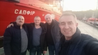 Chaplains Vasyl Vyrozub, Leonid Bolharov, Oleksandr Chokov, and doctor Ivan Tarasenko in front of the Sapfir vessel. Odesa, February 25, 2022 