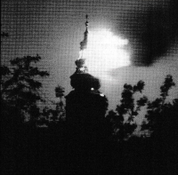 Hořící věž kroměřížského zámku po německém ostřelování. Poslední dny války