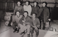 The photo shows the witness (back row, second from the right) with his work colleagues.