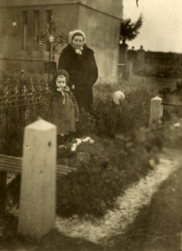 Olga Vlachová with her daughter at the grave of Vladimír Vlach at the Šumperk Military Cemetery
