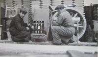 Her father working as an electrician in the dairy in Opočno (on the left)
