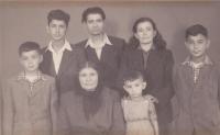The family in Albrechtice in 1954  (from the left: brother Alekos, brother Nikos, father Kostas, mother Maria, Ioannis Charalambidis, grandmother Parfena and brother Jorgos in the front)
