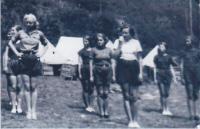 Růžena Homolková during a Scout camp (2nd in the left row)