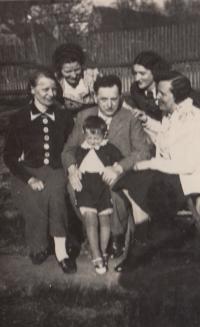 1937; with his father and family