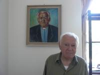 Don Jozef Hrdý in front of his portrait in Šaštín