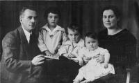 With his parents and sisters