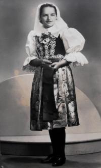 Anna is wearing the folk costume of Velké Karlovice, 1940