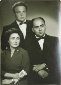 with her brothers in July 1957