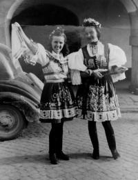 With her friend in the folk costume (on the right)