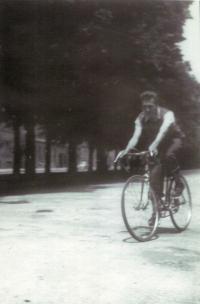 Ivan Kania on his new racing bycicle, Brno, tř. kpt. Jaroše (1950)