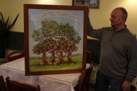 Stefan Pnacek with a genealogy tree of his family in Kraslice, restaurant U Pnacku, 2015