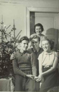With his sister, brother and aunt on Christmas 1952
