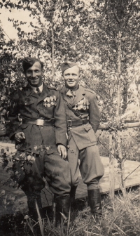 witness (right) in uniform before February 1948