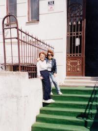 Brno, in front of former home with sister, cca 2000