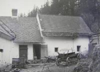 On the left the additional part of the house and the roof where the father had his secret hiding place, Benák hamlet, before 1977