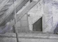 Entrance to the secret hiding place, the board served to conceal the entrance door, Benák hamlet, before 1977