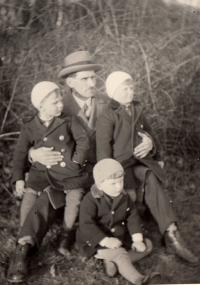 Father Josef Pešata with sons Jan and Josef, the third child is unknown