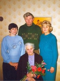 With her mother and siblings, Marie on the right