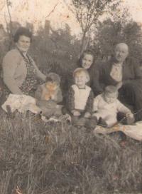 Mother, father and kids, grandmother Ranka, in the orchard of a family house in Petrovaradin/Srbija,1959