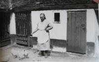 Mother Sládková on the yard of her house