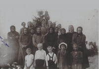 A group of women and children who survived the burning of Bohemian Malina
