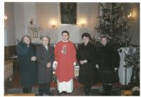 With wife and priest (left)