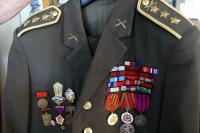 Part of the uniform. L.Janouch with distinctions