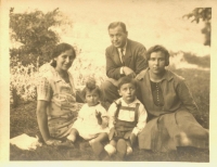 With her parents, her brother, and her beloved maid, Máňa 

