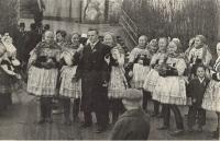 Antony in the folk costume, in the back in the middle, holding a child's hand, date unknown