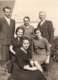 With her parents and siblings in front of their house in Markt Schwaben, 1960