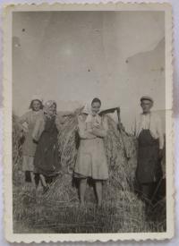 During harvest-time in 1949 - with her parents and sister