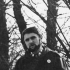 Pamětník po návratu z Mnichova, 1969. Na sobě má americký kabát za 50 marek, s odznakem Flowers power